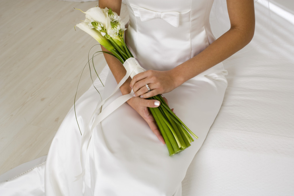 Close-up of bride holding bouquet